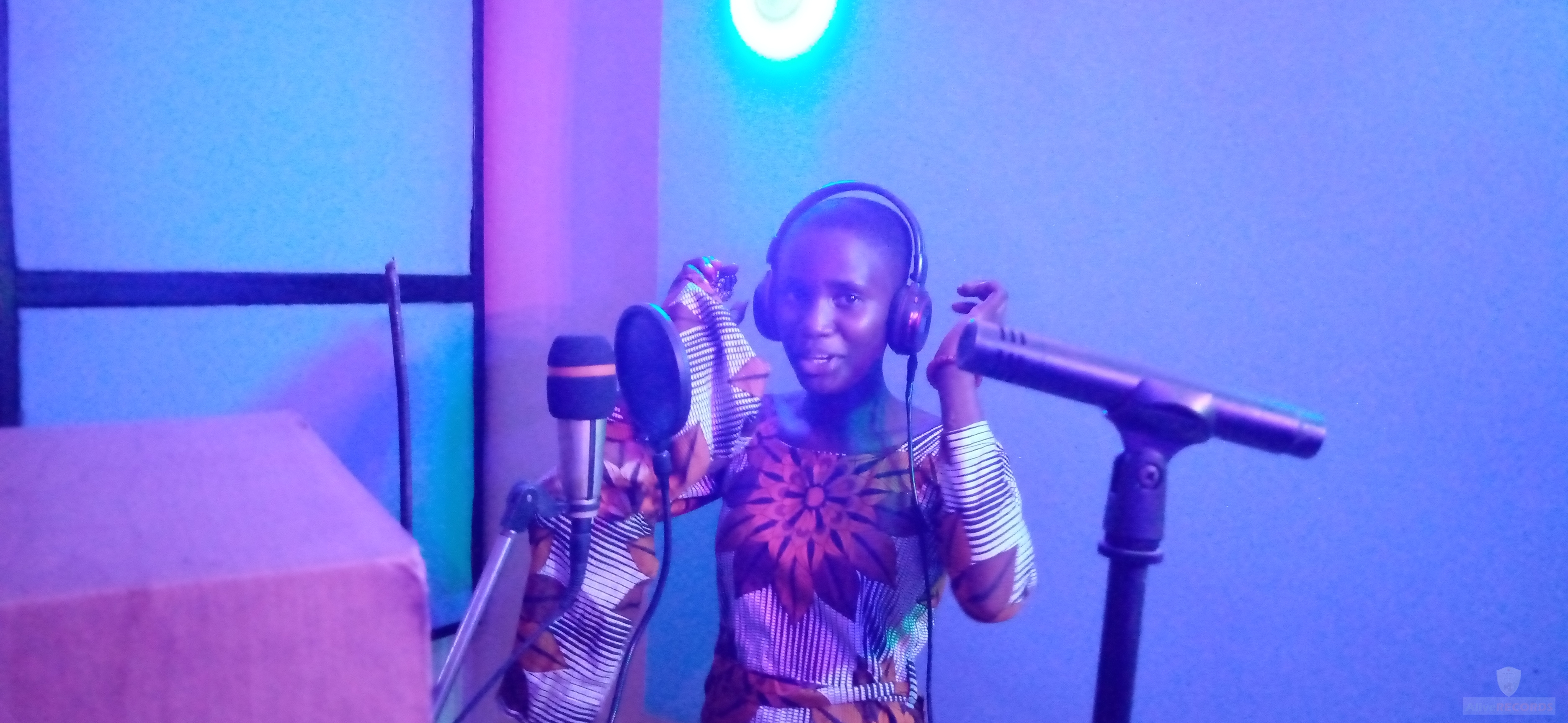 Joy backing up on the song secret place by Alive Kelvin. She is amazing